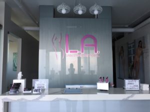 LA Laser Custom Interior Sign II anodized brushed pink on high gloss Dibond mounted on glass